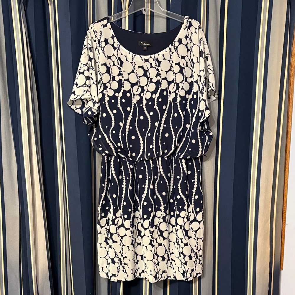 Fun and funky navy and white polka dots dress. S.L. Fashions, size 18W.